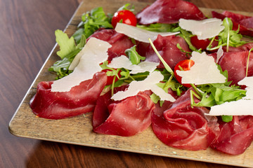 close up of delicious cured ham, italian style with parmesan