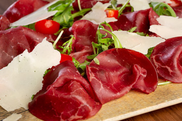 close up of delicious cured ham, italian style with parmesan