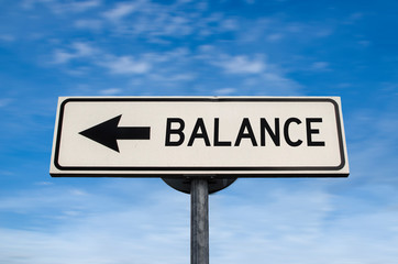 Balance road sign, arrow on blue sky background. One way blank road sign with copy space. Arrow on a pole pointing in one direction.