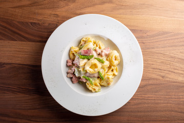 details of fresh hot tortellini with meat and sauce