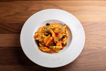 details of fresh pasta with tomato and veggie, italian style