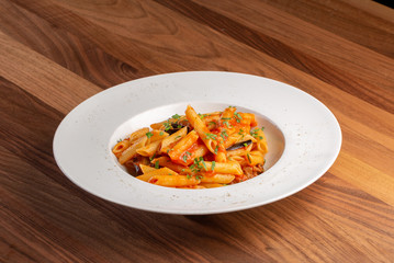 details of fresh pasta with tomato and veggie, italian style