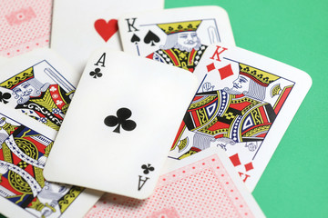 playing cards on the green poker table.  Gambling. Addiction. Bets