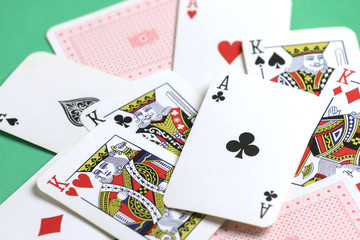 playing cards on the green poker table.  Gambling. Addiction. Bets