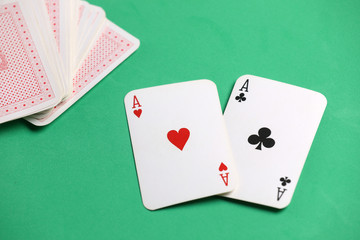 playing cards on the green poker table.  Gambling. Addiction. Bets