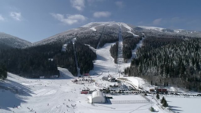 Snow mountain full of people skiing Bjelasnica