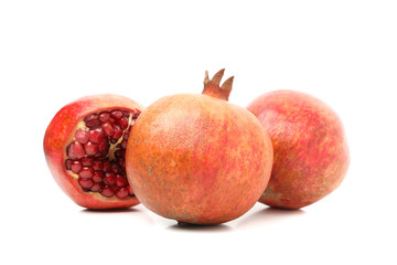Group of pomegranate isolated on white background. Juicy fruit