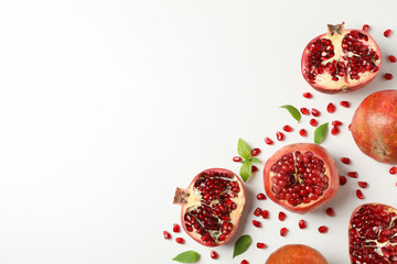 Pomegranate, juice and seeds on white background, top view