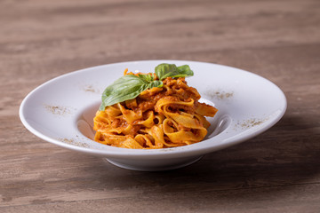 close up of tasty fresh pasta with bolognese sauce