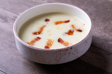 close up of cream soup with bacon
