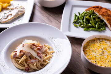 details of various types of meal, on a wooden background