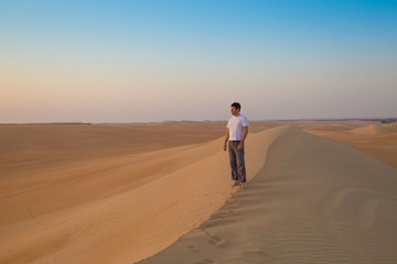 Fototapeta na wymiar UAE. Man in desert