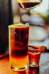 Iced coffee with  fresh honey   or iced americano  In Glass On wood tabel, The drink menu