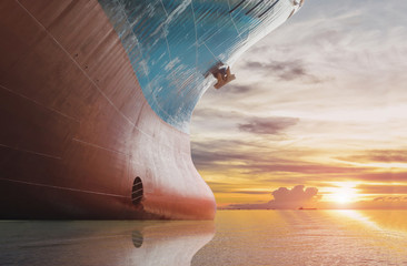 Fototapeta premium Ship moored in the sea close up side front ship with copy space with sunset background.