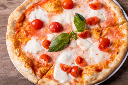 close up of delicious tomato and cheese italian classic pizza