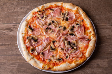 details of tasty ham and mushrooms pizza
