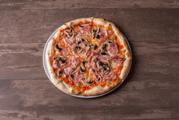 details of tasty ham and mushrooms pizza