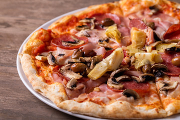 details of tasty ham salami and mushrooms pizza