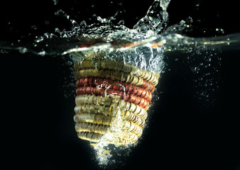 wooden basket falling down dropping down in water creating water splashes and bubbles under water...