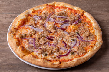 details of tasty tuna pizza with red onions