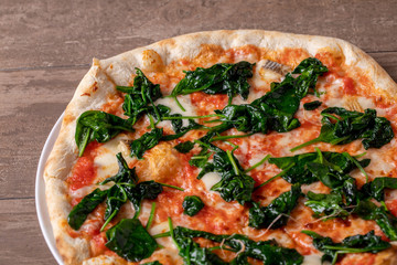 details of fresh tasty spinach pizza