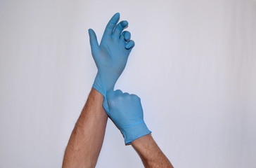 hands in rubber gloves