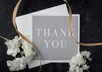 A floral touch makes this thank you note an elegant addition to a wedding or shower inviitation with classy combination of gentle colors