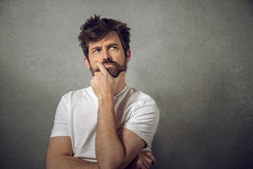 Funny portrait man thinking funny face long hair and beard on isolated background