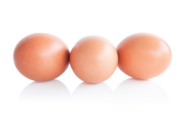 Raw chicken eggs on white background with clipping path