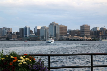 The boat is on its way across the harbor.