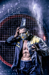 Man wearing respirator ffp3 typy. Worker in th the dust. Dirty mine. Miner on the background of...