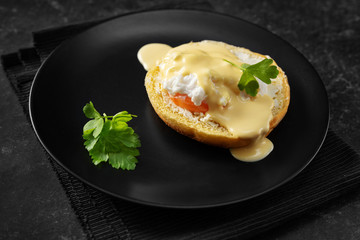 Crop shot of poached egg in a black plate