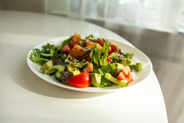 spring salad on a white table