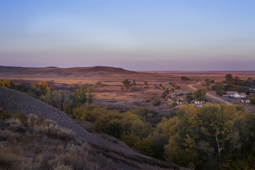 Fototapeta na wymiar Landscape Steppe hills in autumn at sunset