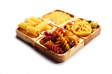 Varied pasta wooden puzzle form on a white background. Isolated object