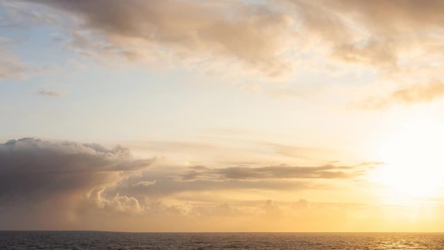 Cinemagraph Continuous Loop Animation. Dramatic View of a cloudscape during a dark, rainy and colorful sunset. Taken on the Ocean Coast of Alaska, USA.