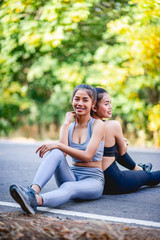 Women exercise happily for good health. Exercise concept