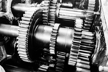 Gears in a mechanical gearbox, teamwork concept, dependence on each other.