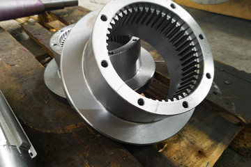 Round gears after turning and milling on the rack closeup.