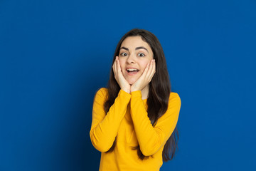 Brunette young girl wearing yellow jersey