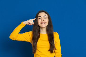 Fototapeta premium Brunette young girl wearing yellow jersey