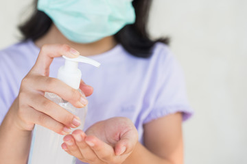 asia women wearing hygienic mask to prevent the virus PM2.5, Coronavirus, (2019-nCoV) asian little girl washing hands with alcohol gel or antibacterial soap sanitizer,virus. healthcare concept..
