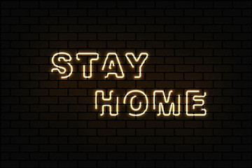 Stay home brightly sign in neon style on dark brick wall . Coronavirus Covid-19 pandemic protection and prevention effort. Social activity message. Quarantine.