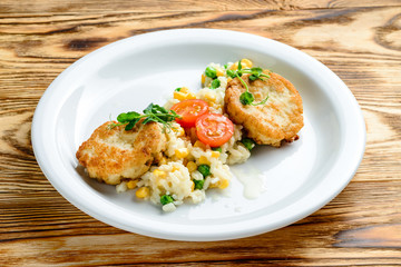 chicken cutlet with a plan with a side dish of rice