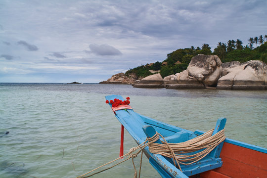 boats with floral ribbons in Chalok baan kao bay in Koh Tao island, Chumphon Archipelago, Thailand