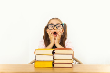 education and school concept - smiling little student girl with many books at school