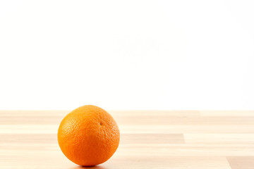 Fresh orange fruit on wooden table isolated