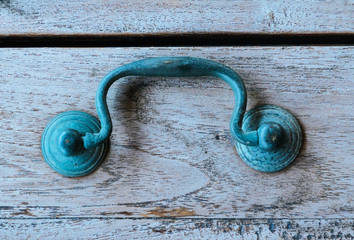 Close up of an antique blue latch