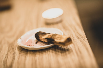 Incense made of wood is burning in the room.