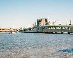 Naklejka premium Raised Drawbridge and Boat About to Enter Crossing Channel